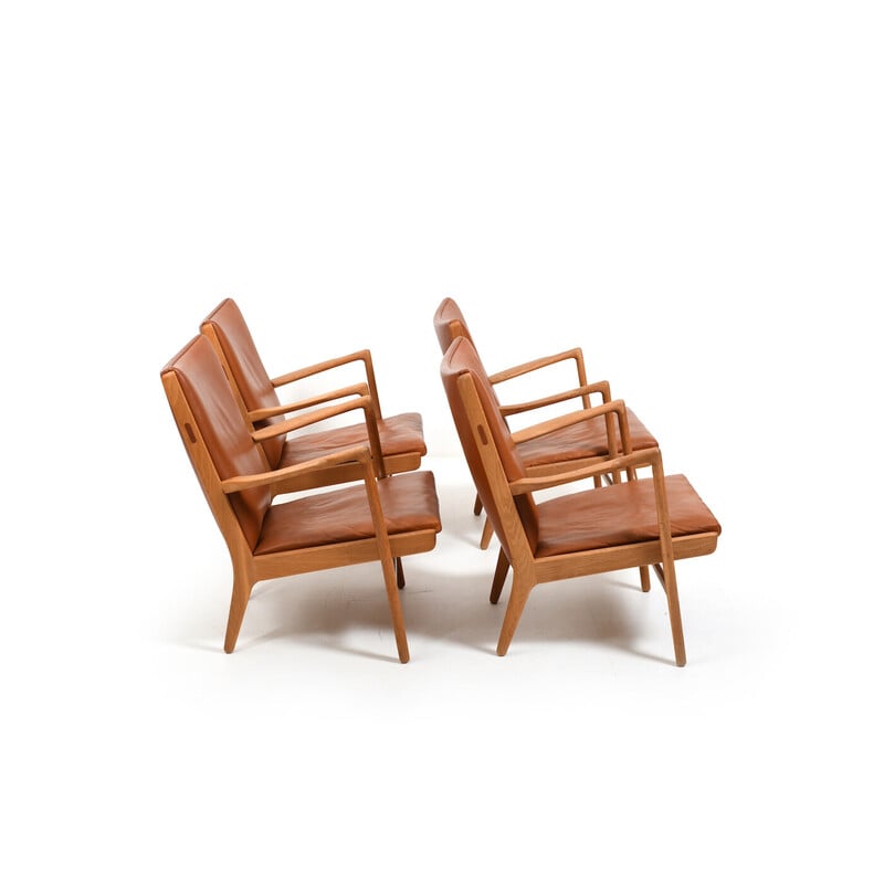 Set of 4 vintage oak and cognac leather armchairs by Hans J. Wegner for AP Stolen, Denmark 1951