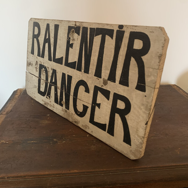 Vintage wooden "slow down danger" sign