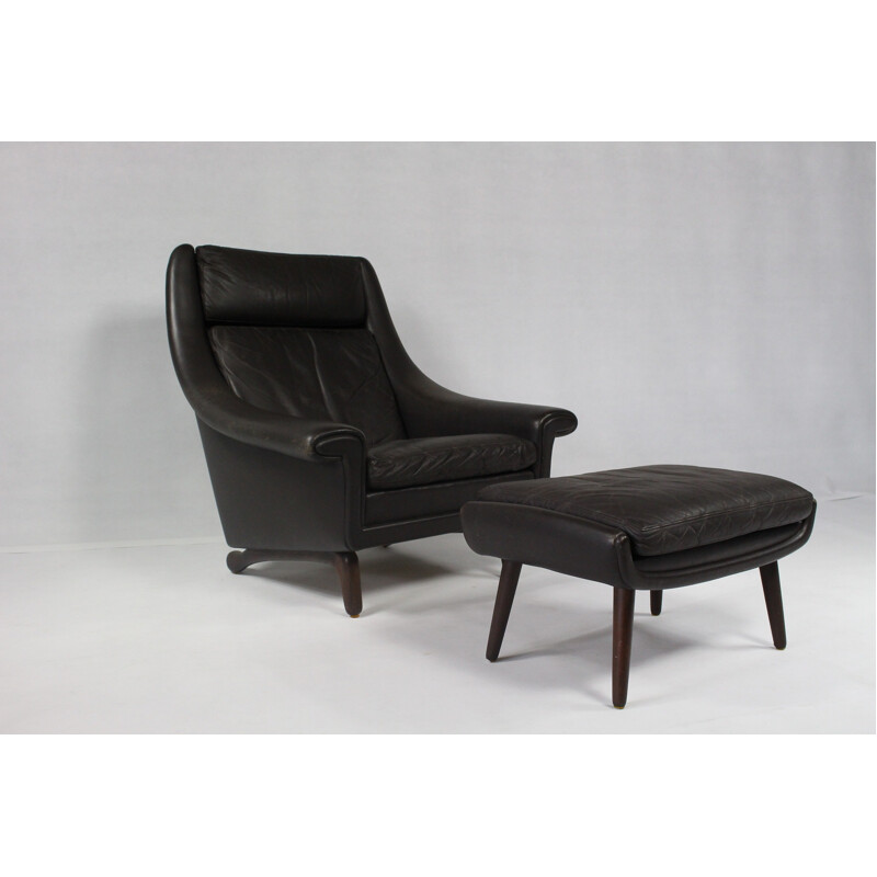 Leather armchair with ottoman in rosewood - 1970s