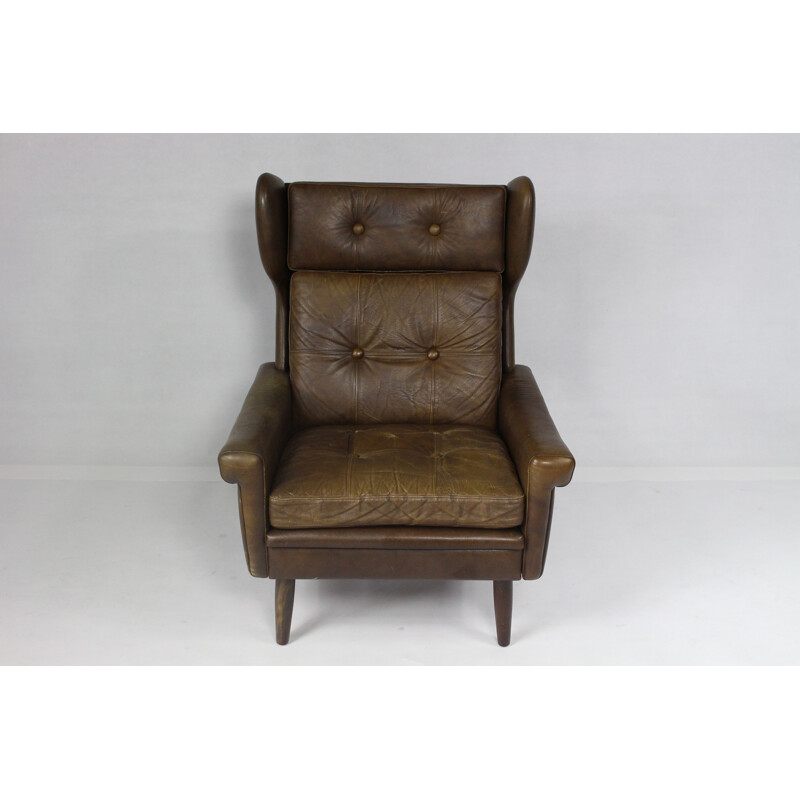 Modern wingback easy chair in brown leather - 1970s