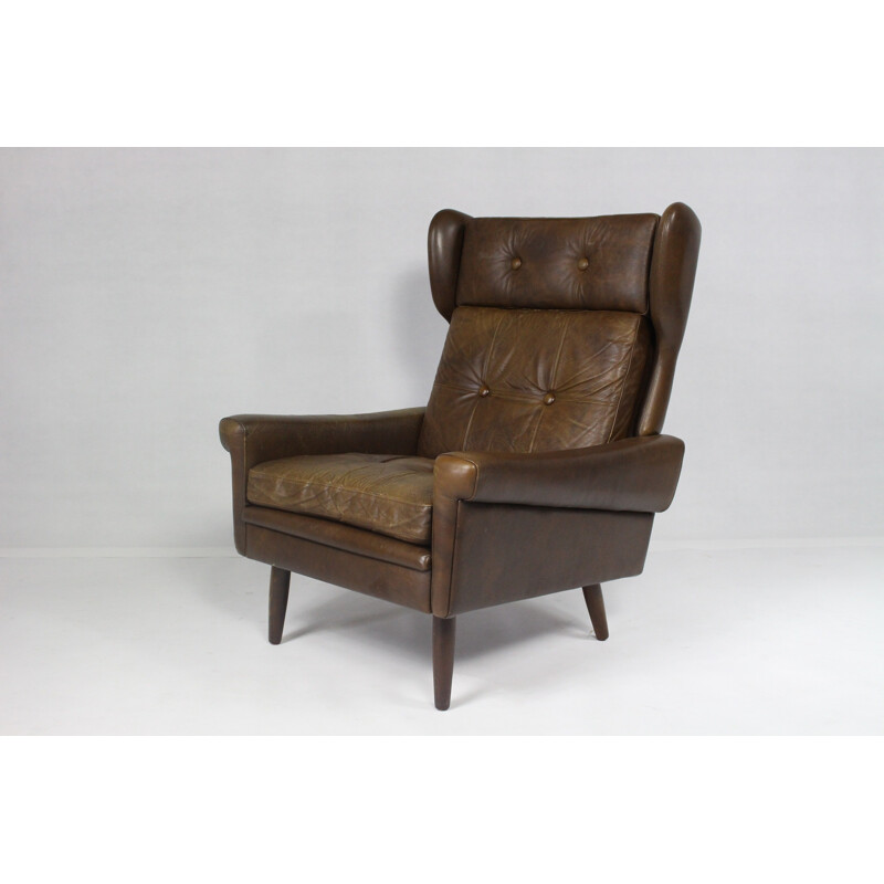 Modern wingback easy chair in brown leather - 1970s