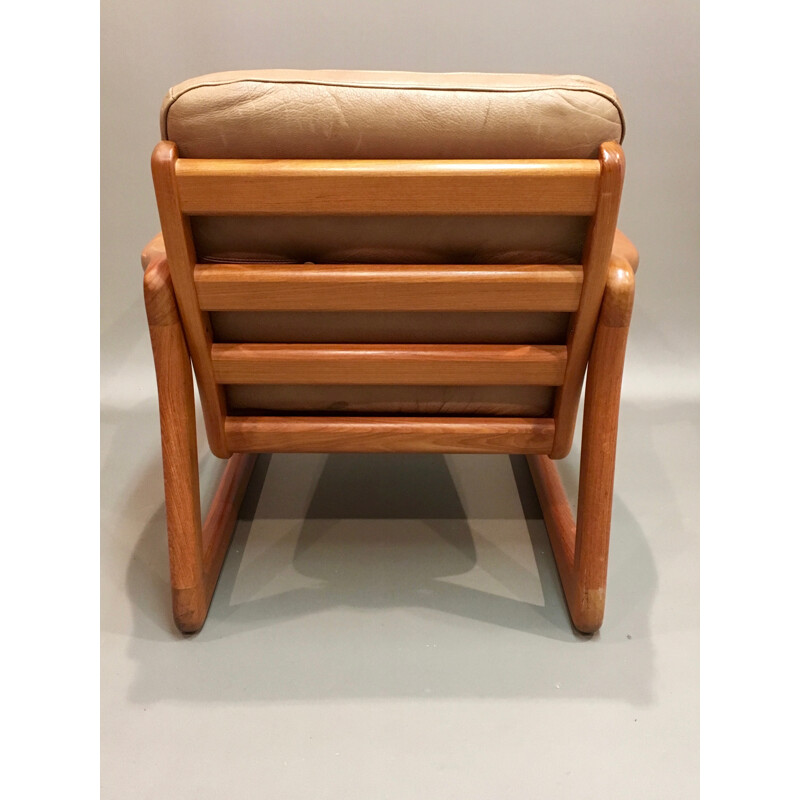 Brown Scandinavian armchair in teak and leather - 1950s