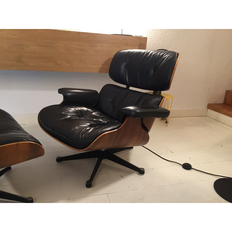 Black easy chair with ottoman by Charles and Ray Eames produced by Mobilier International - 1980s