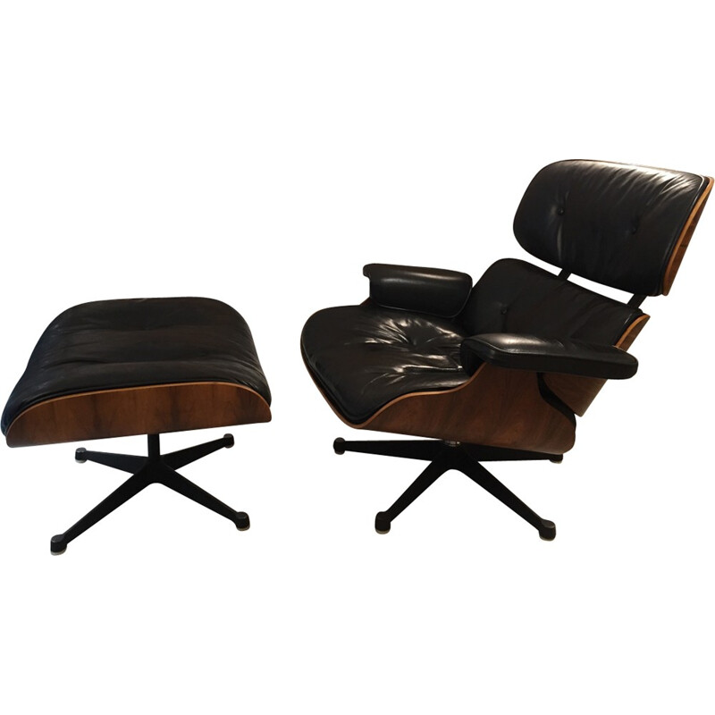 Ensemble fauteuil et ottoman noirs en palissandre et en cuir de Charles et Ray Eames fabriqué par Mobilier International - 1980