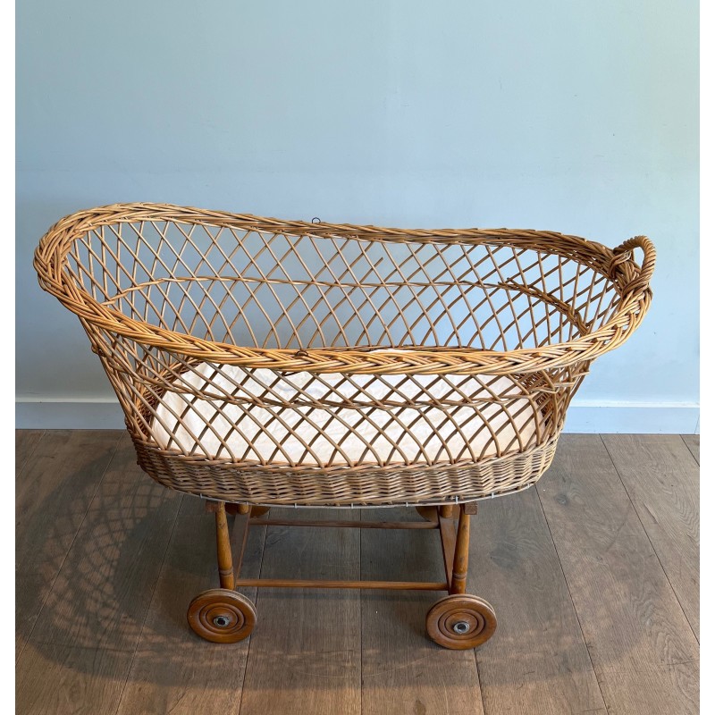 Vintage rattan cradle on wheels, France 1950