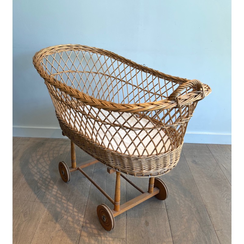 Vintage rattan cradle on wheels, France 1950