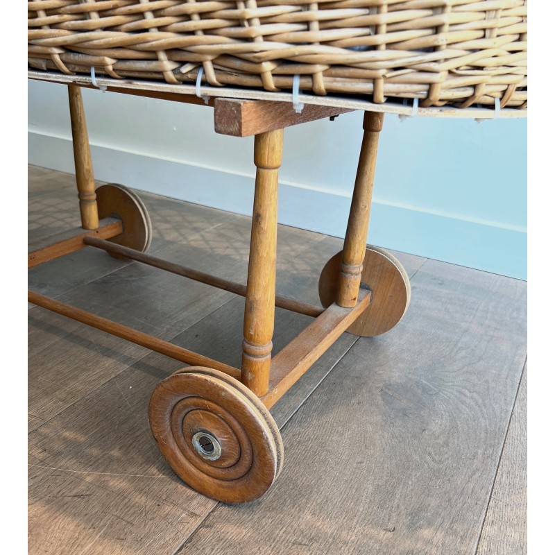 Vintage rattan cradle on wheels, France 1950