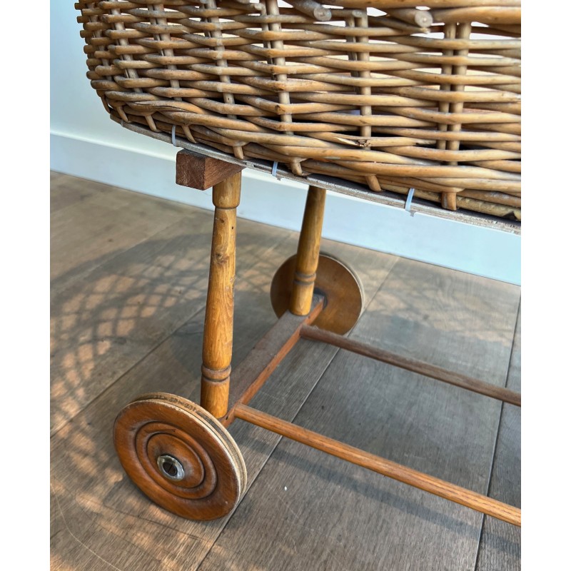 Vintage rattan cradle on wheels, France 1950