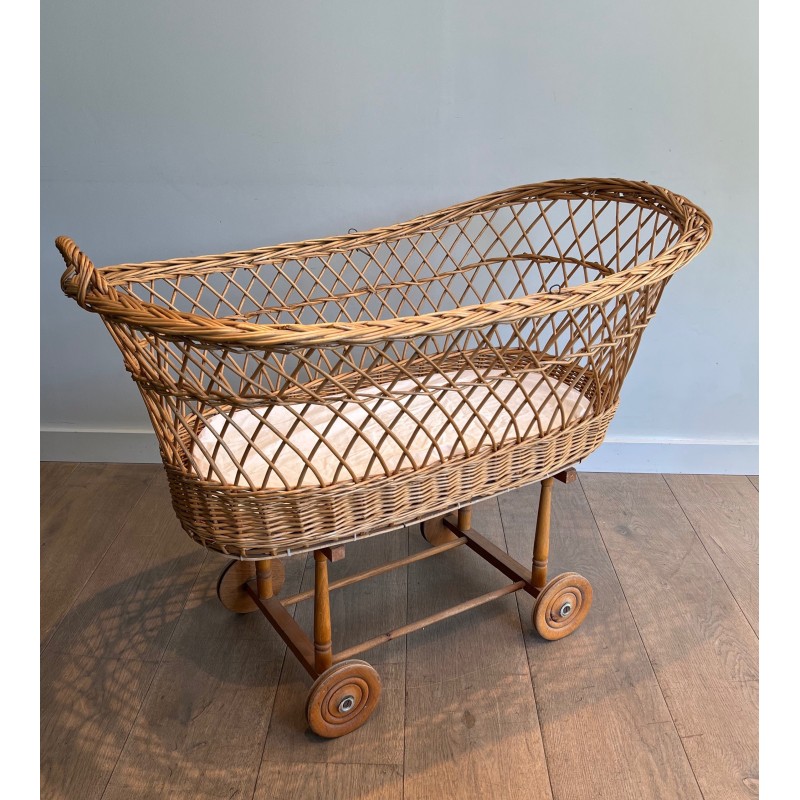 Vintage rattan cradle on wheels, France 1950