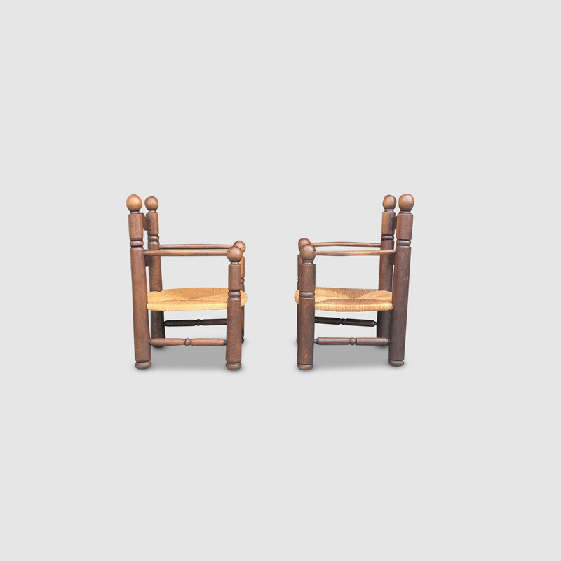 Pair of vintage oak and wicker fireplace armchairs by Charles Dudouyt, France 1950