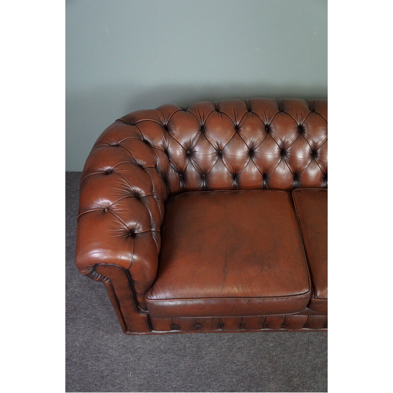 Vintage chesterfield sofa in cowhide leather