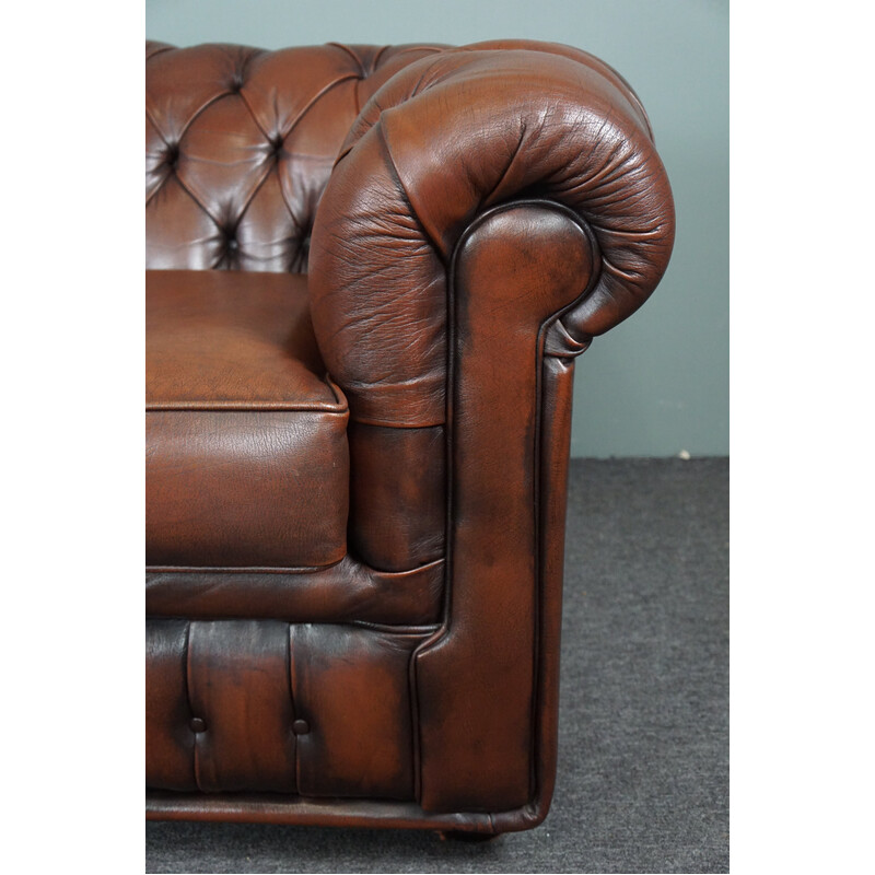 Vintage chesterfield sofa in cowhide leather