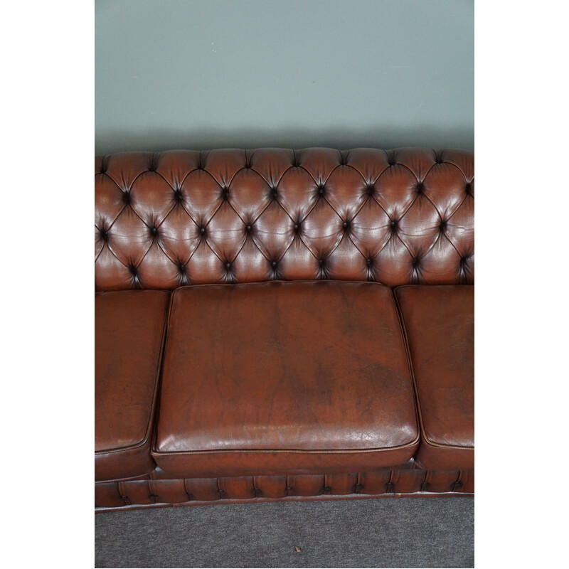 Vintage chesterfield sofa in cowhide leather