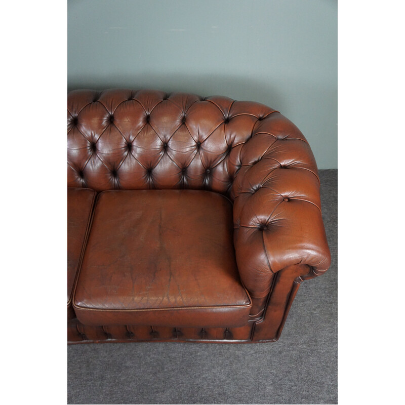 Vintage chesterfield sofa in cowhide leather