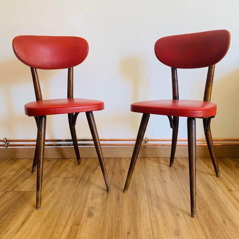 Pair of vintage red beech and skai chairs