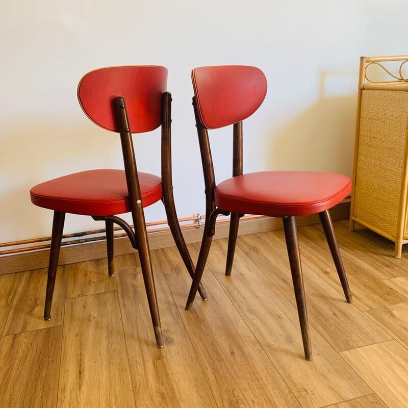 Pair of vintage red beech and skai chairs