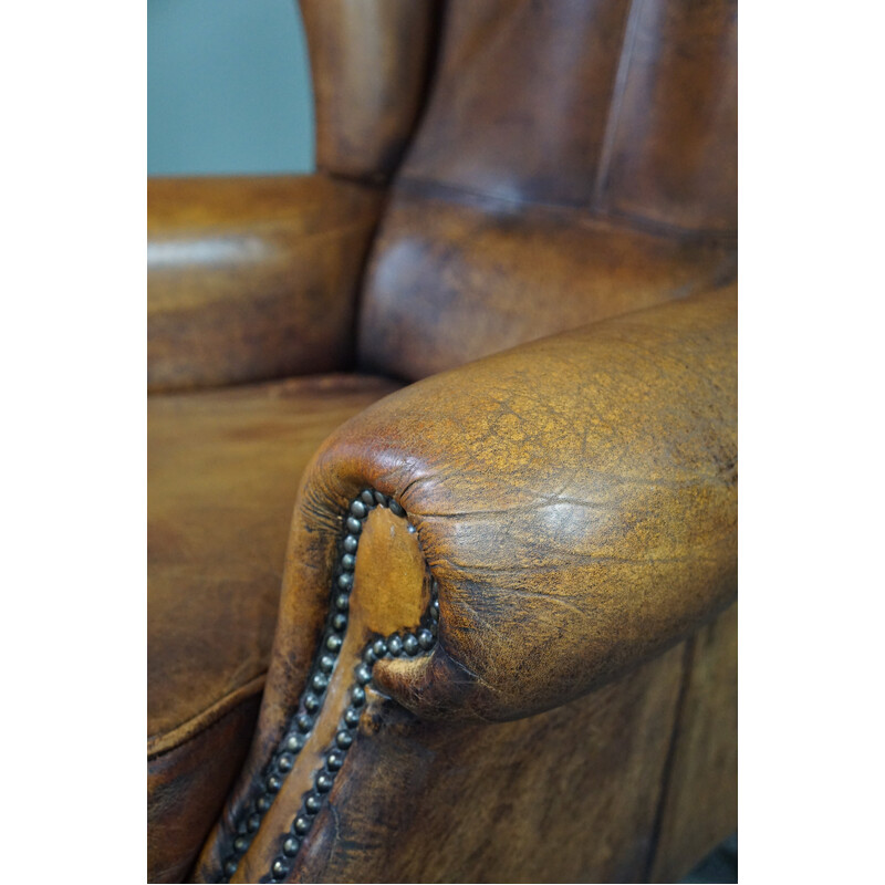 Vintage sheepskin leather wing chair