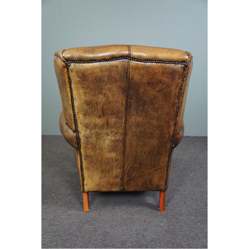 Vintage sheepskin leather wing chair