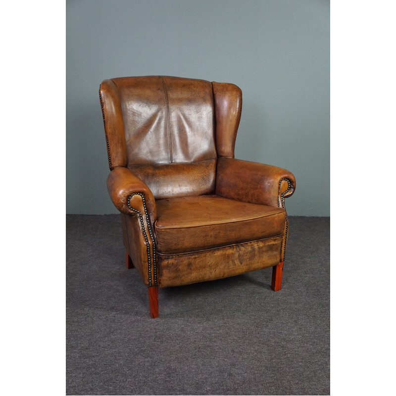 Vintage sheepskin leather wing chair