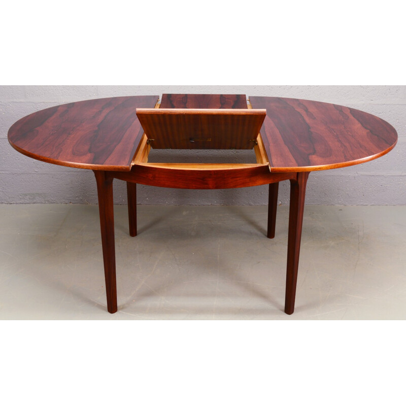 Circular rosewood extendable dining table by Nathan - 1960s