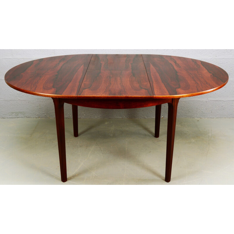 Circular rosewood extendable dining table by Nathan - 1960s