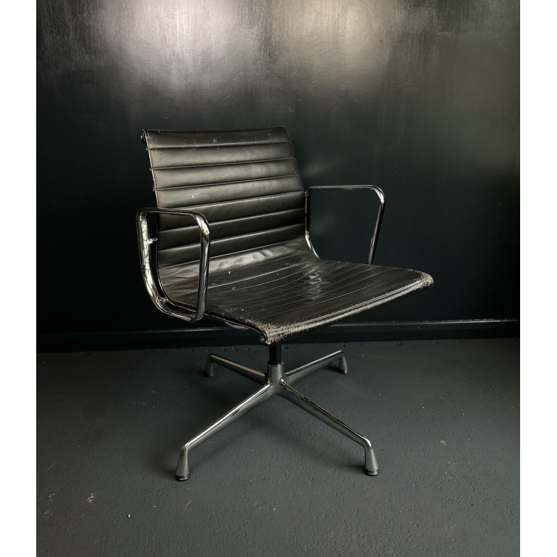 Vintage EA108 swivel armchair in aluminum and leather by Charles and Ray Eames for Vitra