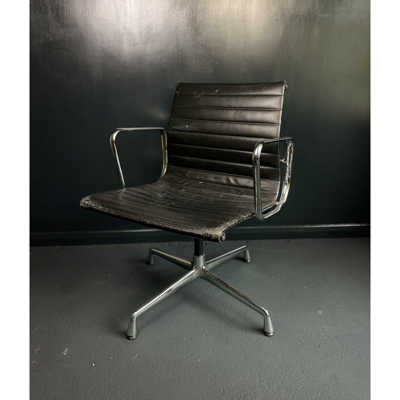 Vintage EA108 swivel armchair in aluminum and leather by Charles and Ray Eames for Vitra