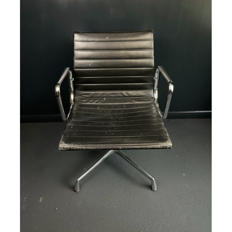 Vintage EA108 swivel armchair in aluminum and leather by Charles and Ray Eames for Vitra