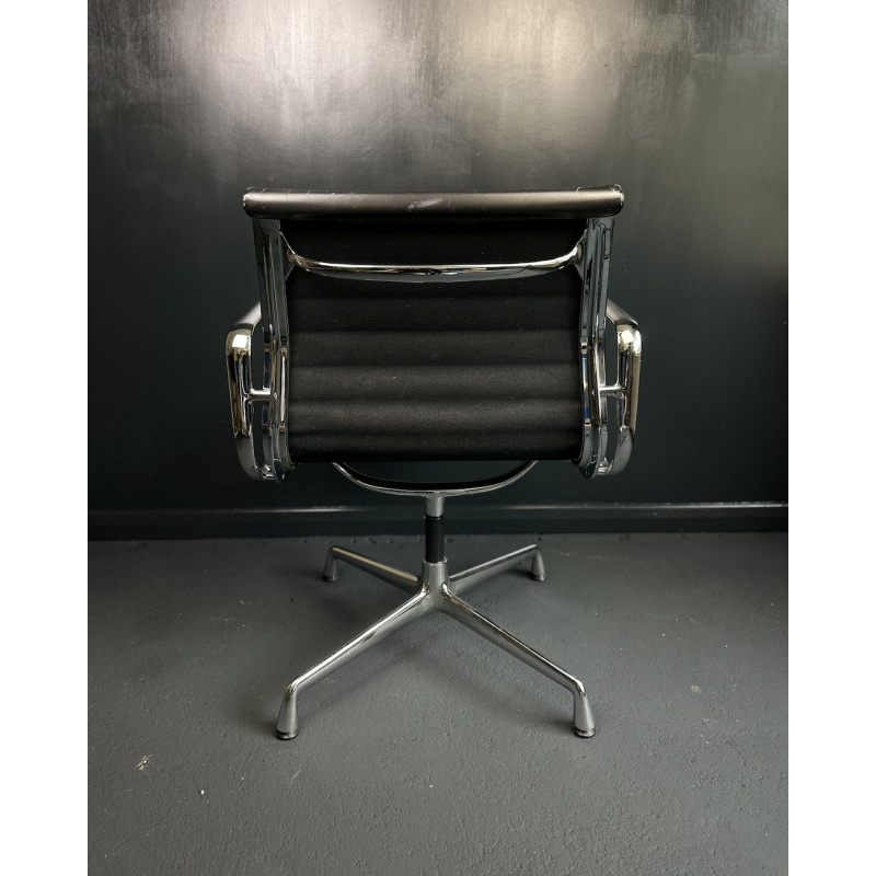 Vintage EA108 swivel armchair in aluminum and leather by Charles and Ray Eames for Vitra