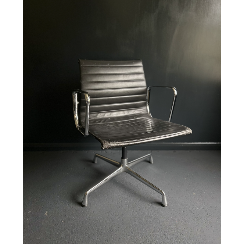 Vintage EA108 swivel armchair in aluminum and leather by Charles and Ray Eames for Vitra