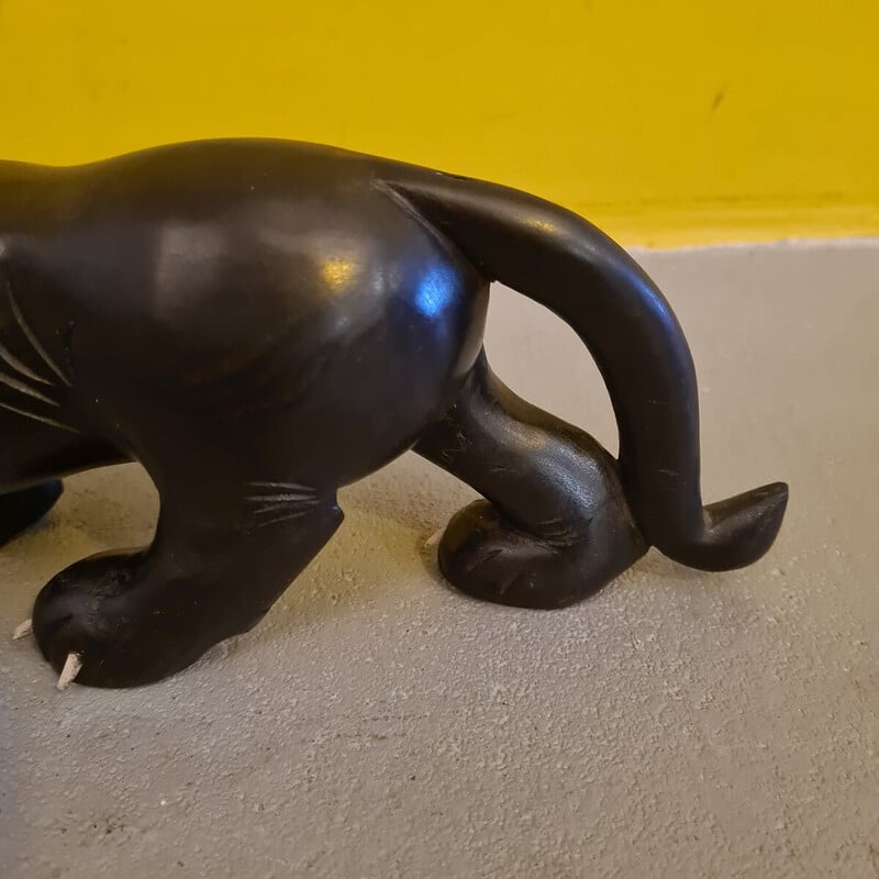 Vintage ebony sculpture depicting a menacing lion, 1940