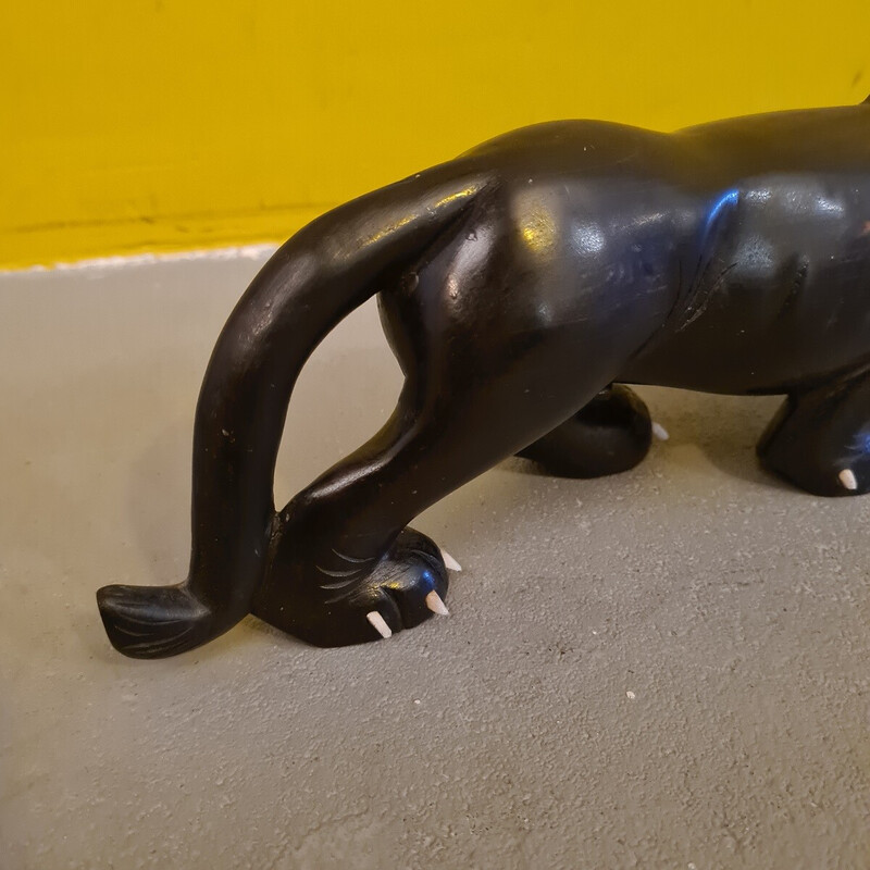 Vintage ebony sculpture depicting a menacing lion, 1940