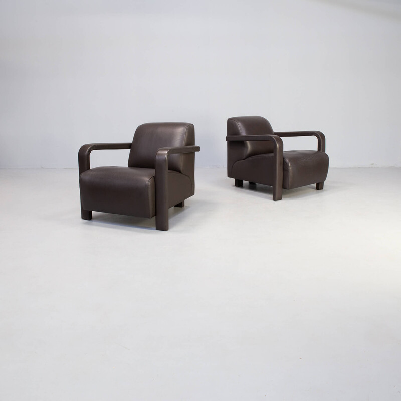 Paar vitange 'Hemmingway' fauteuils in donkerbruin leer van Hugo voor Leolux