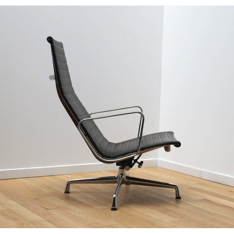 Vintage EA124 office armchair in chrome aluminum and leather by Charles and Ray Eames for Vitra