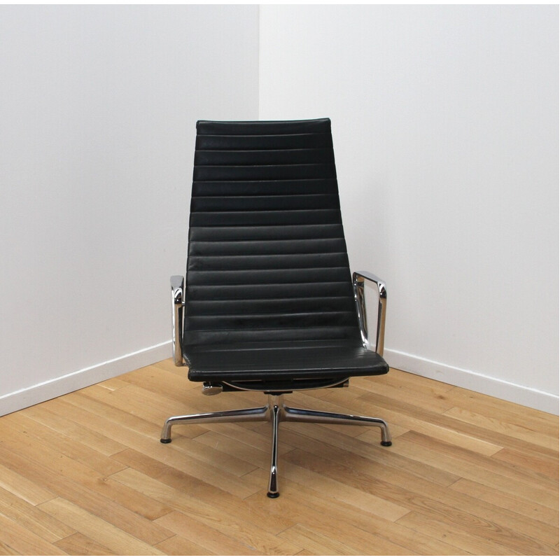 Vintage EA124 office armchair in chrome aluminum and leather by Charles and Ray Eames for Vitra