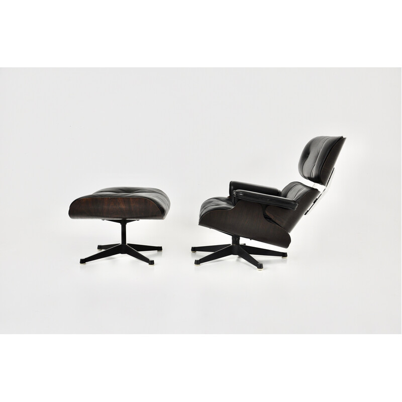 Vintage armchair with ottoman in black leather and wood by Charles and Ray Eames for Icf, 1970