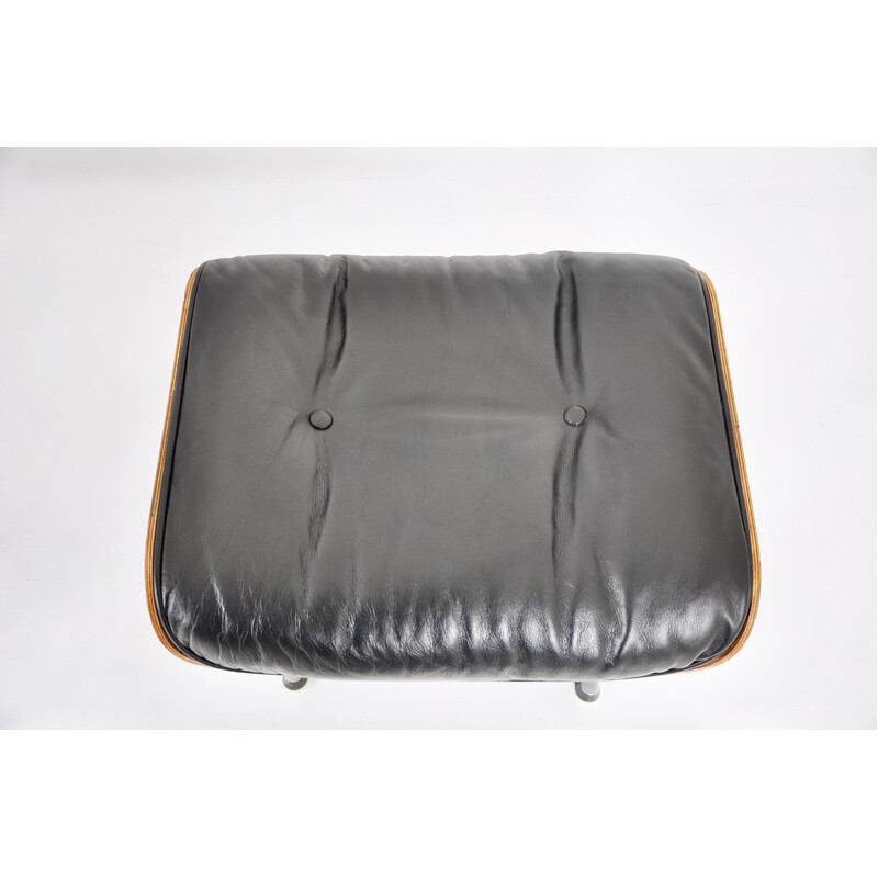 Vintage armchair with ottoman in black leather and wood by Charles and Ray Eames for Icf, 1970