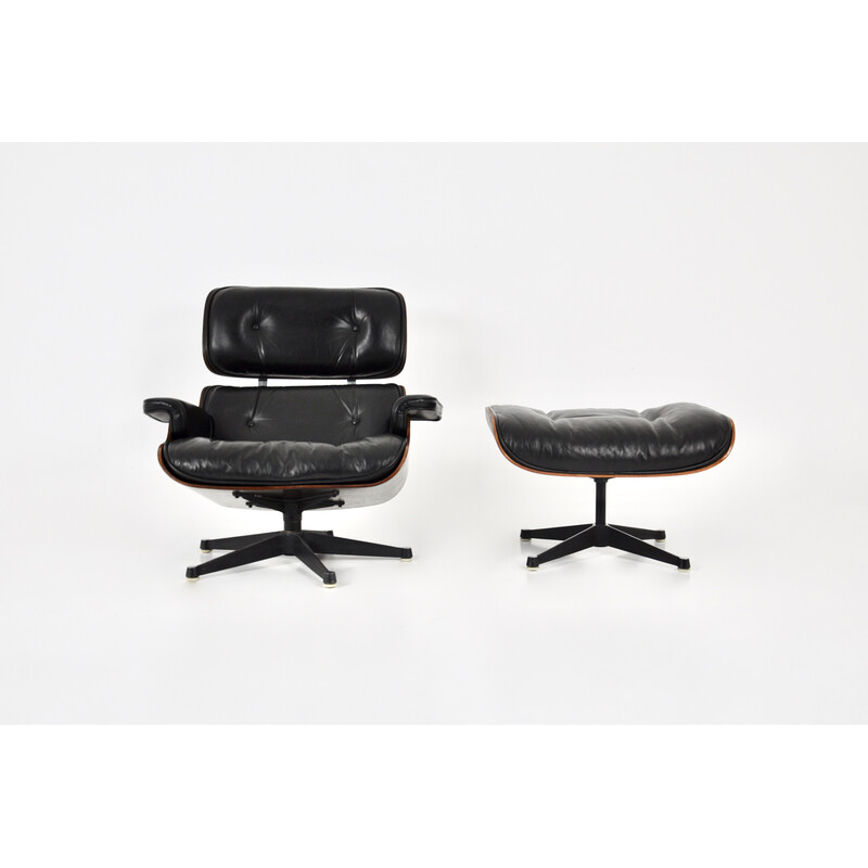 Vintage armchair with ottoman in black leather and wood by Charles and Ray Eames for Icf, 1970
