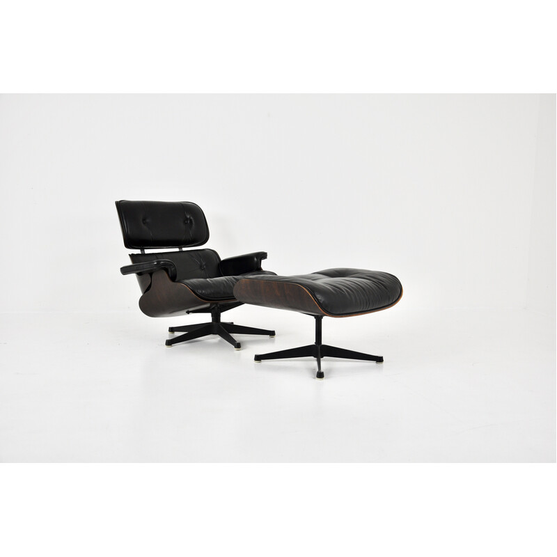 Vintage armchair with ottoman in black leather and wood by Charles and Ray Eames for Icf, 1970