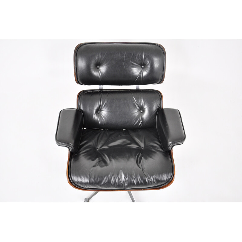 Vintage armchair with ottoman in black leather and wood by Charles and Ray Eames for Icf, 1970