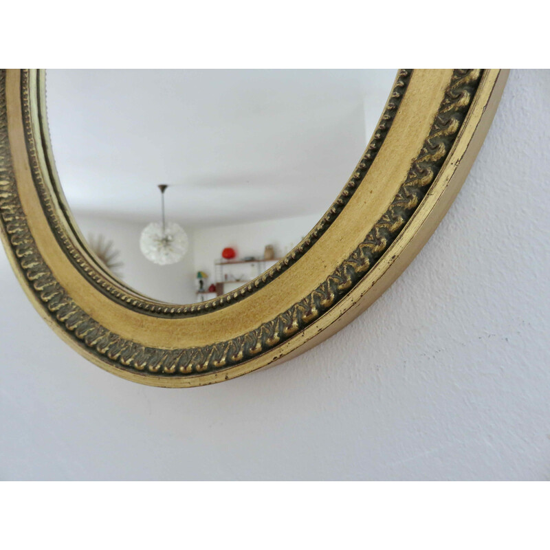 Vintage oval wall mirror in gold resin and wooden back by Louis Philippe, France 1950