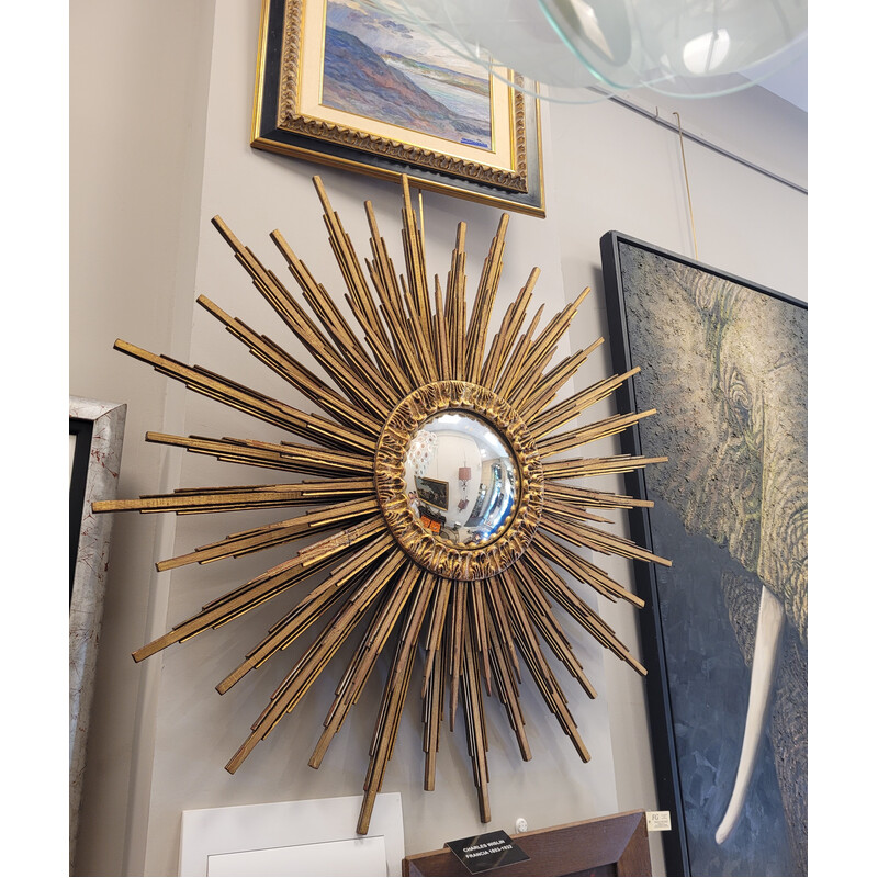 Vintage convex mirror in carved and gilded wood in the shape of a sun, France 1990