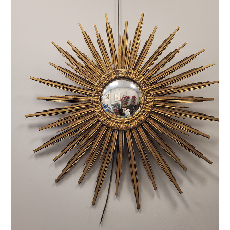 Vintage convex mirror in carved and gilded wood in the shape of a sun, France 1990