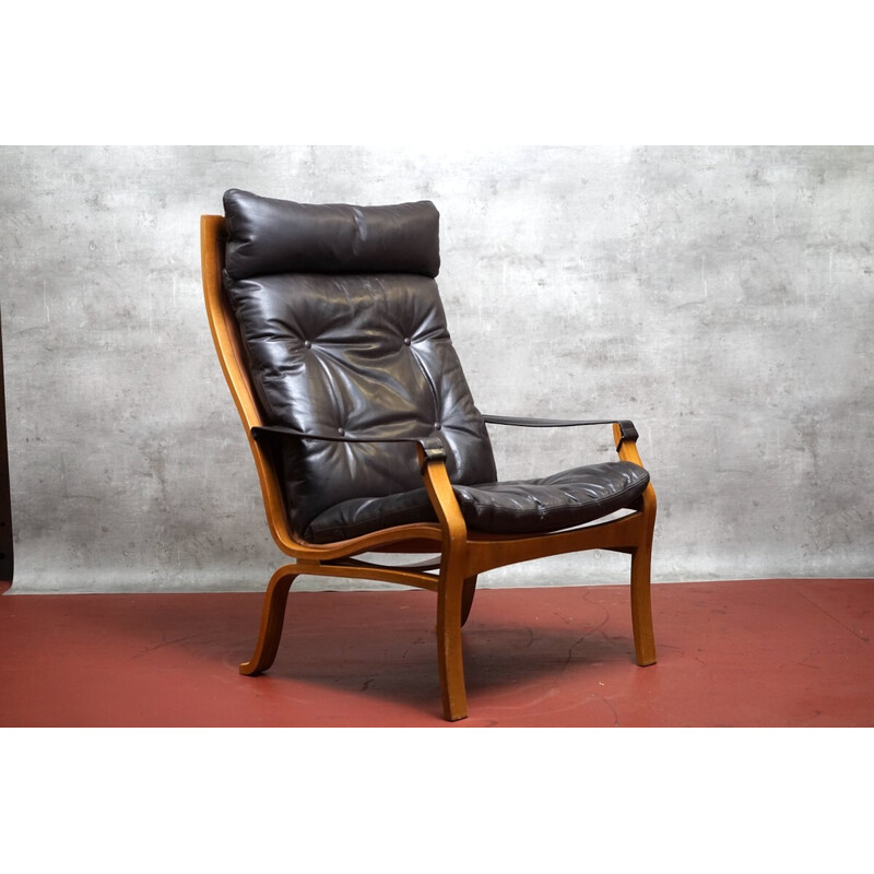 Vintage armchair in wood and aniline leather by Ingmar Relling for Westnofa, Norway 1970