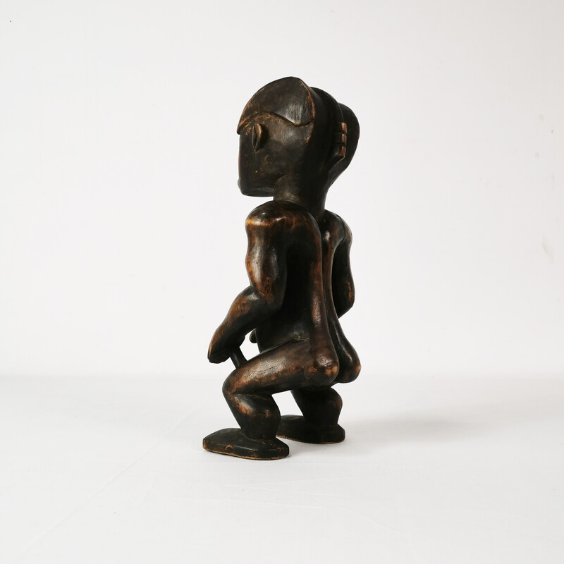 Vintage wooden figurine representing a reliquary guard