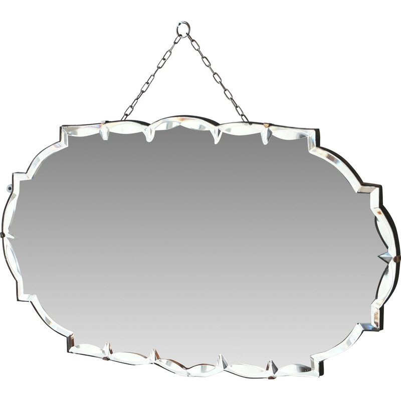 Vintage hexagonal beveled mirror on wooden background, 1950