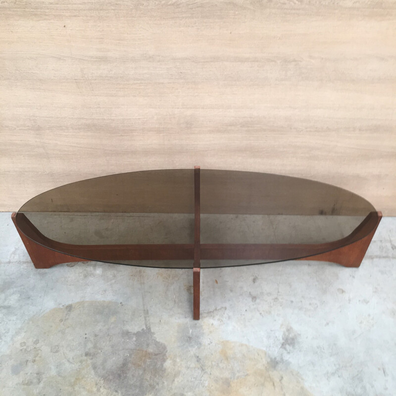 Oval coffee table with a teak base and a smoked glass top by Hugues Poignant - 1960s