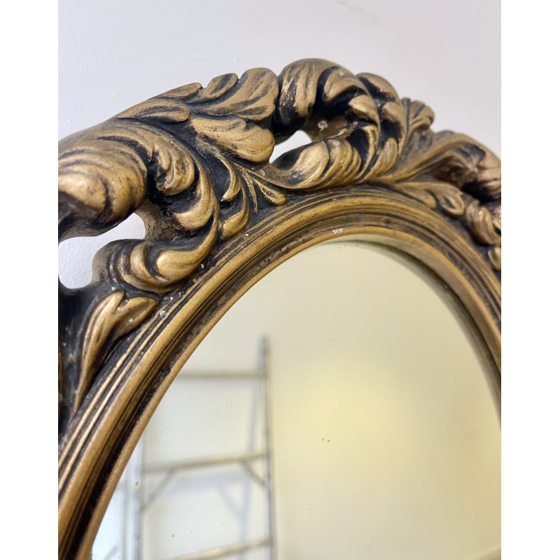 Vintage oval mirror with a carved gold frame, 1960