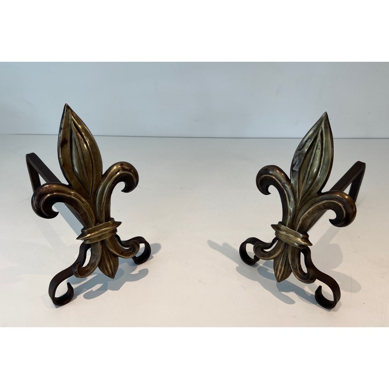 Pair of vintage bronze and wrought iron andirons representing a fleur-de-lys, France 1940