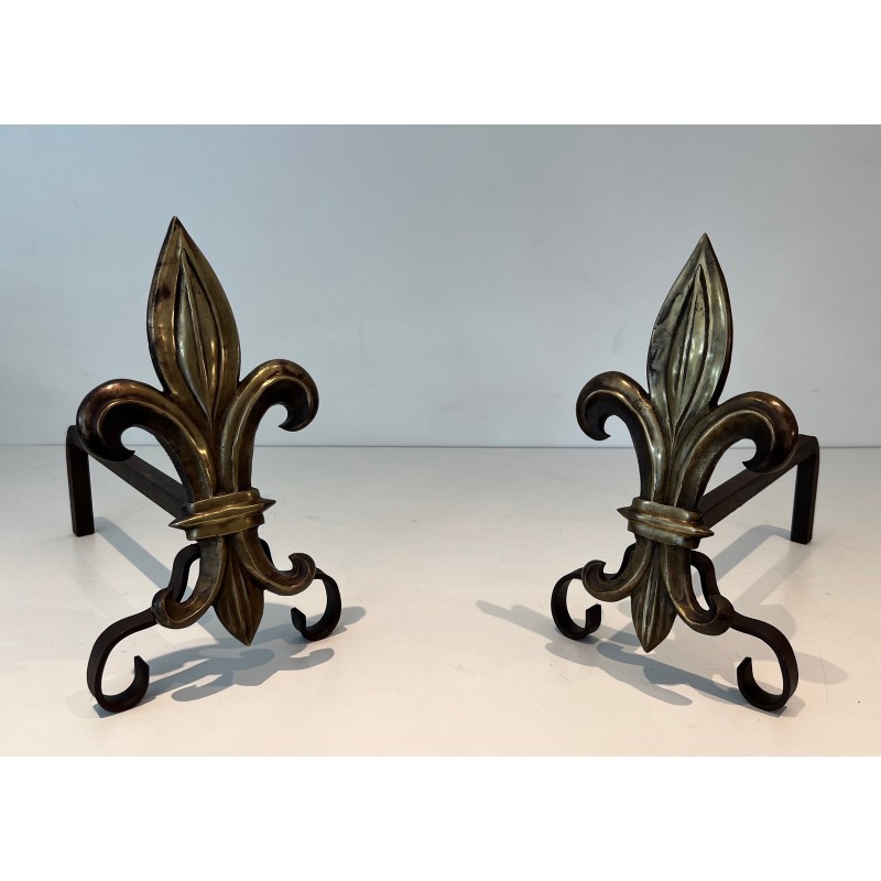 Pair of vintage bronze and wrought iron andirons representing a fleur-de-lys, France 1940